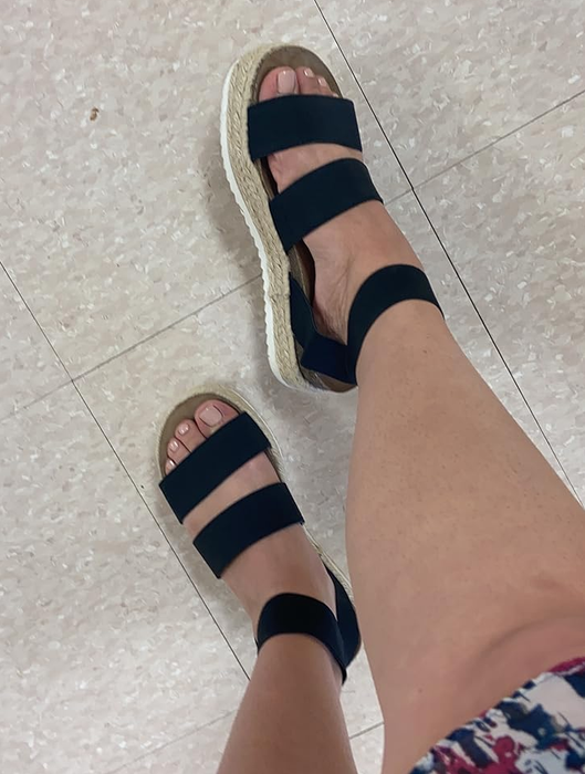 Reviewer wearing black platform espadrille sandals