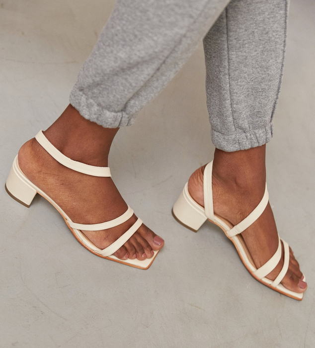 model demonstrating the small chunky heel of the shoes