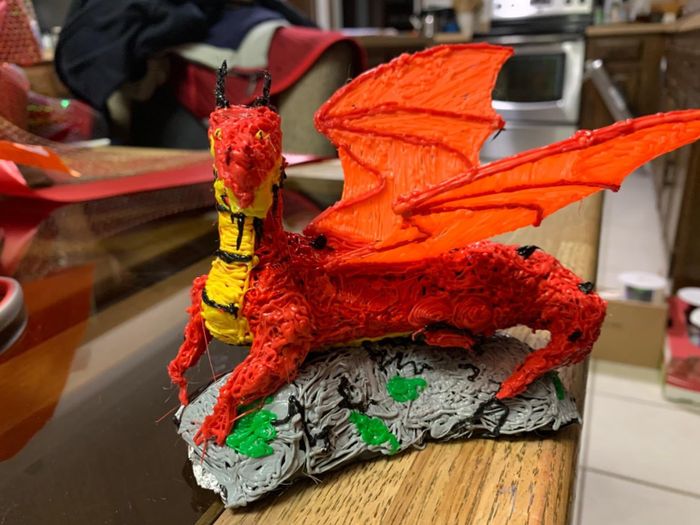A reviewer’s image showcasing a 3D printed dragon.