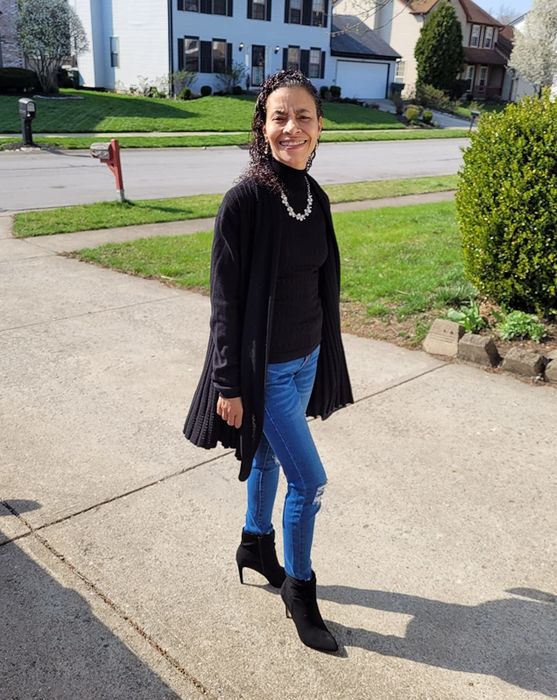 reviewer wearing the black booties