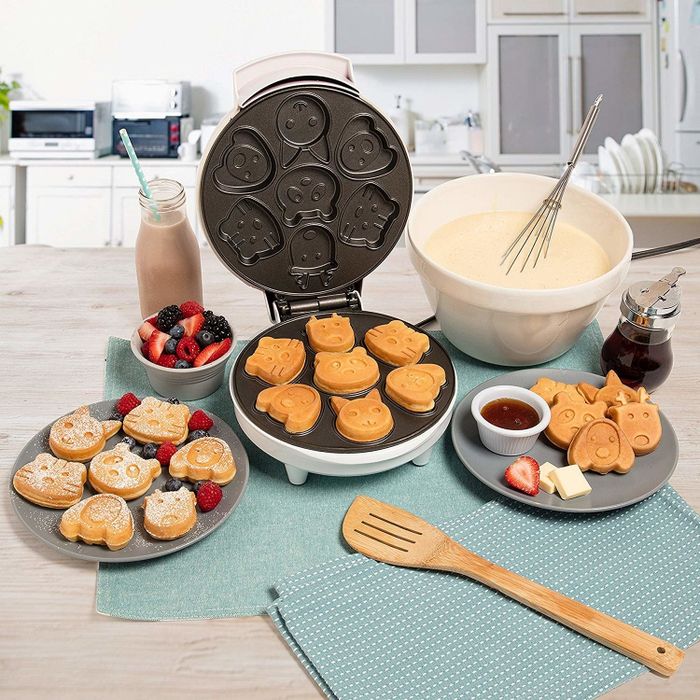 The round waffle maker and small, palm-sized waffles shaped like dog, tiger, cat, deer, and panda faces