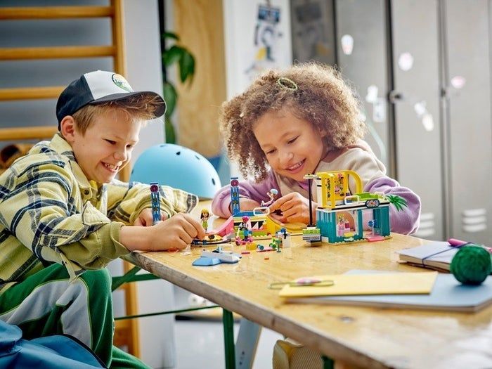 two children enjoying the Lego skate park set