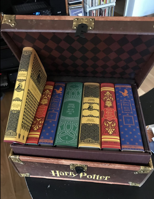 The reviewer’s books placed inside the themed trunk