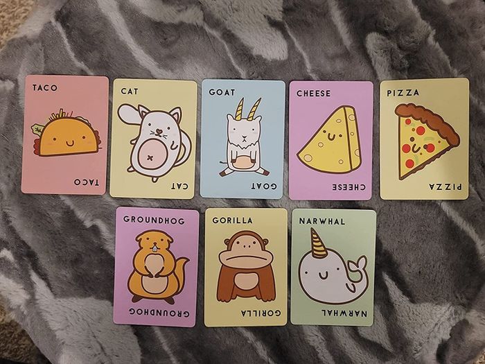 Game cards scattered across a blanket, showcasing the vibrant designs