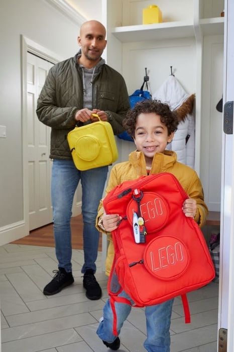 a child with the red backpack
