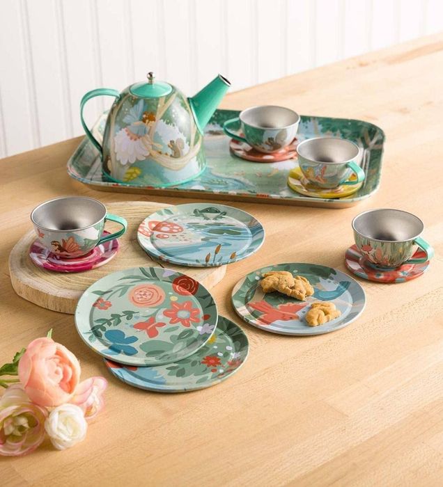 The same tea set featuring a floral and fairy design