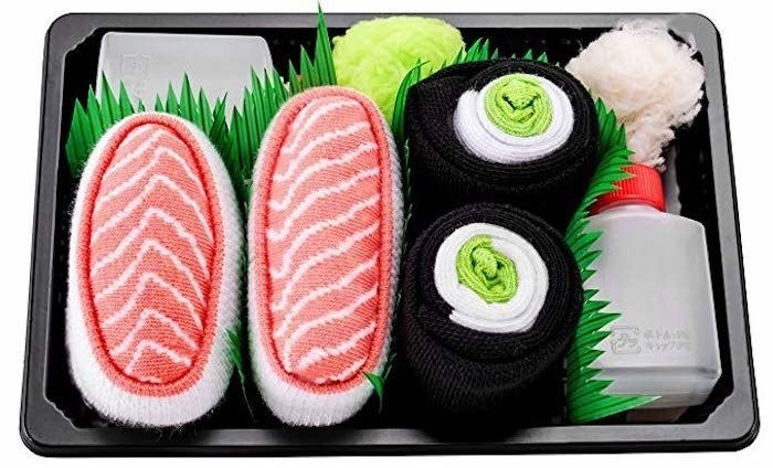 The socks are neatly folded and rolled up, resembling sushi rolls.