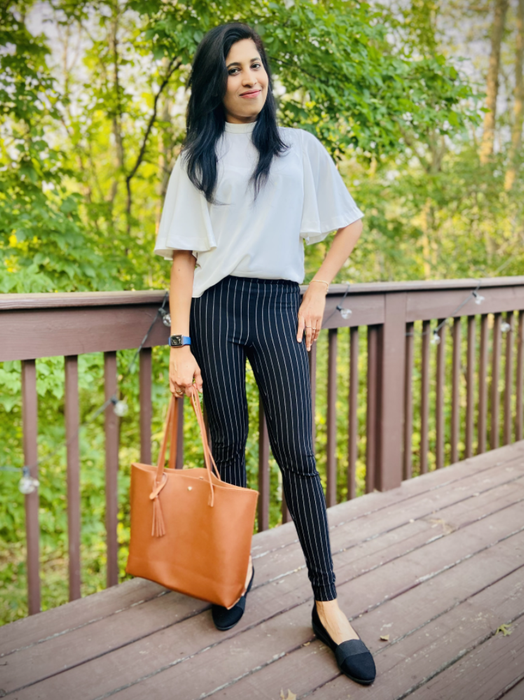 A photo of a reviewer holding the tote bag