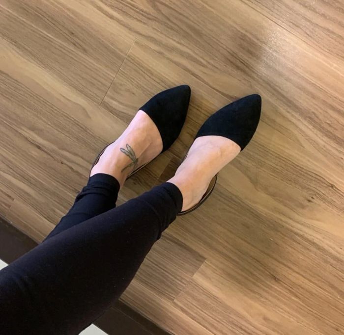 model wearing the black suede boots