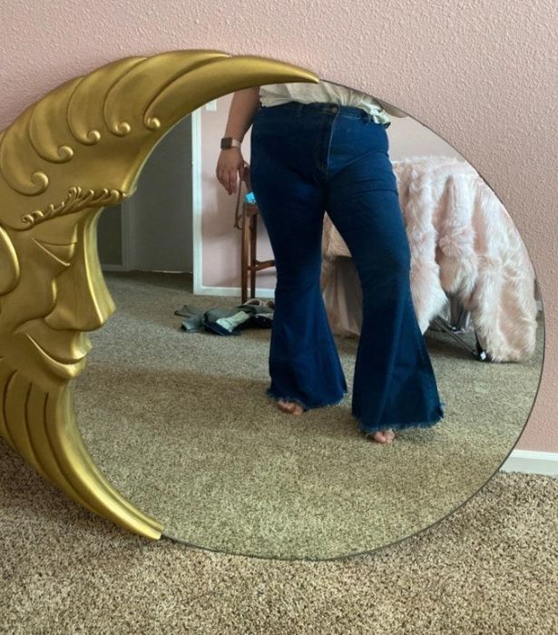 a reviewer snapping a mirror selfie in the jeans