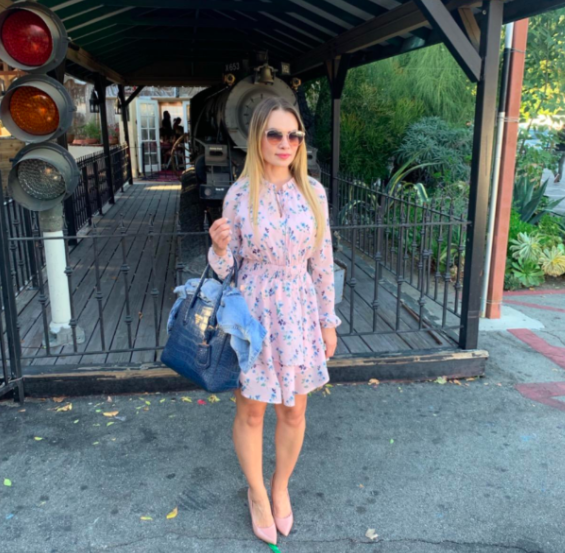 A customer review photo of the pink ruffled dress
