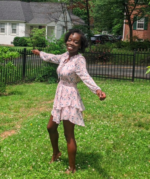 A customer review image of the ruffled dress in a pink shade
