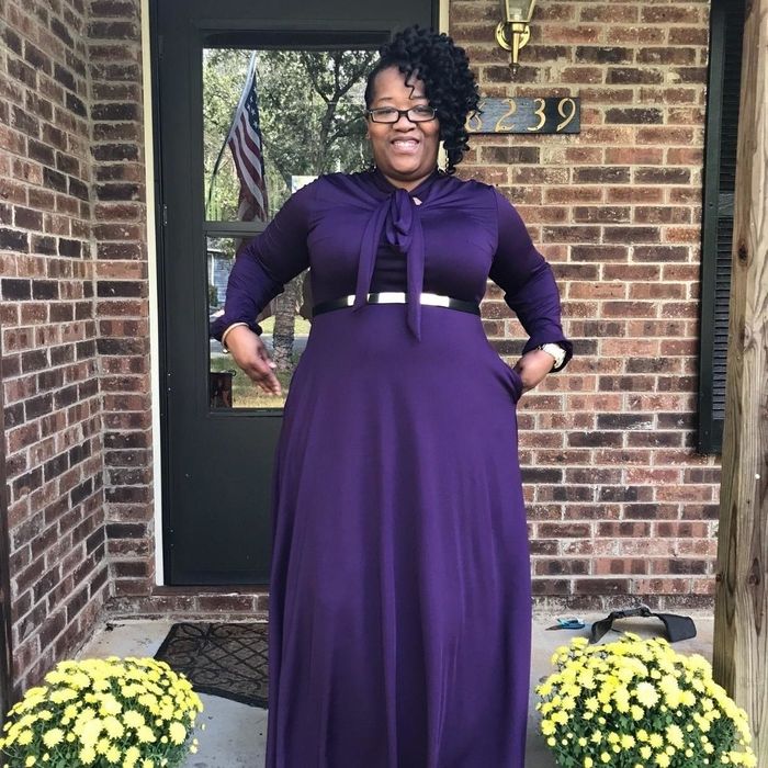 Another reviewer wearing the purple version of the dress with a belt