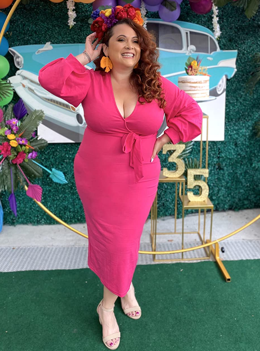 Reviewer in a pink dress