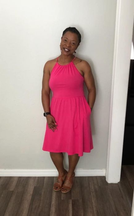 Reviewer in a pink dress