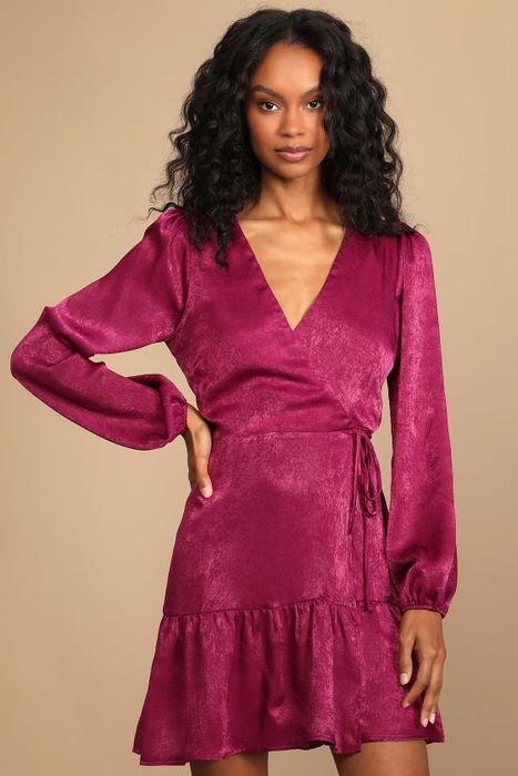 a model showcasing the pink satin long-sleeved wrap dress