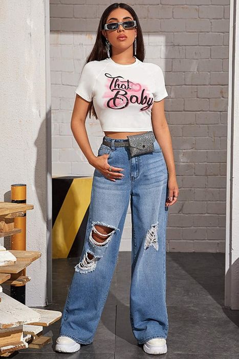 A model wearing light-wash ripped wide-leg jeans, paired with a belt bag.