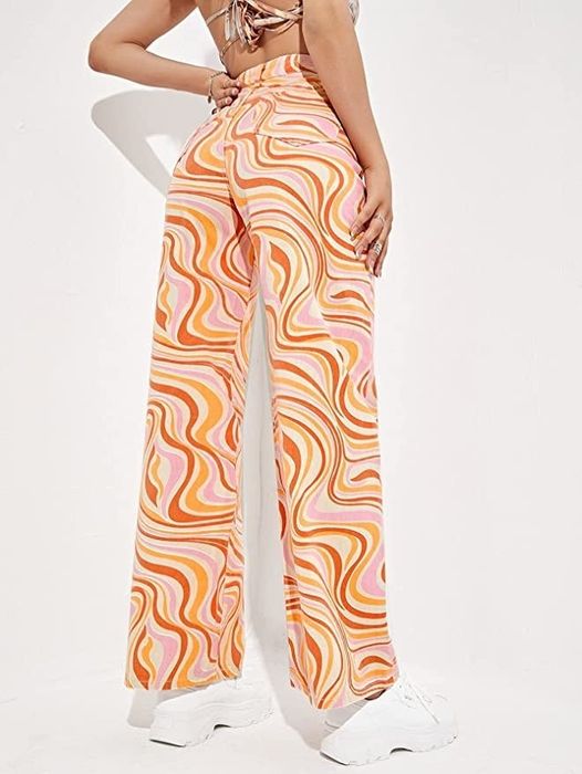 a model wearing the vibrant orange pants