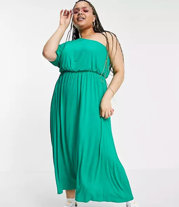 Model showcasing a green dress