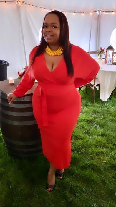 Another reviewer showcasing the red version of the dress