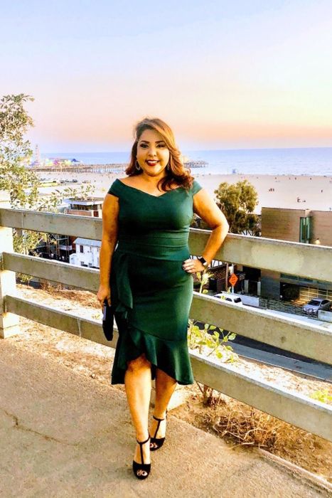 Another reviewer wearing the green variation of the dress
