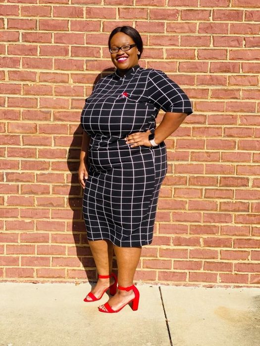 Reviewer in a black and white striped dress