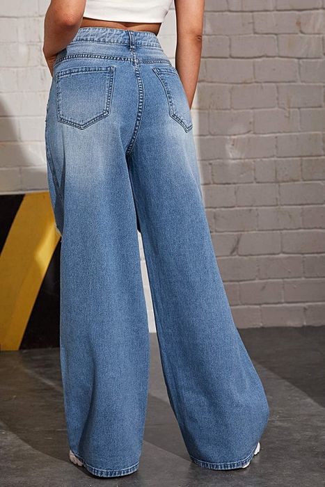 A model presenting the back view of the product.