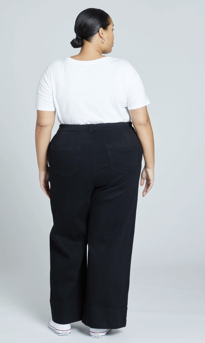 A model showcasing the back of the product against a white background.