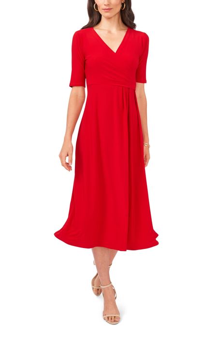 a model showcasing the red dress
