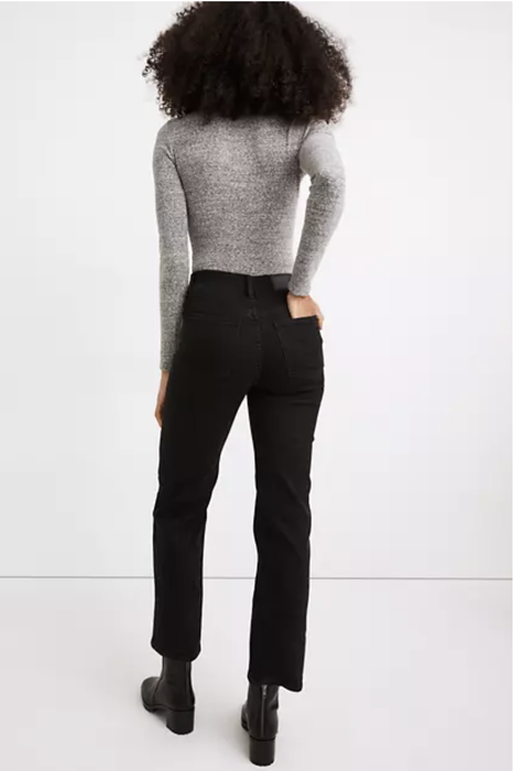 A model showcasing the back view of the product.