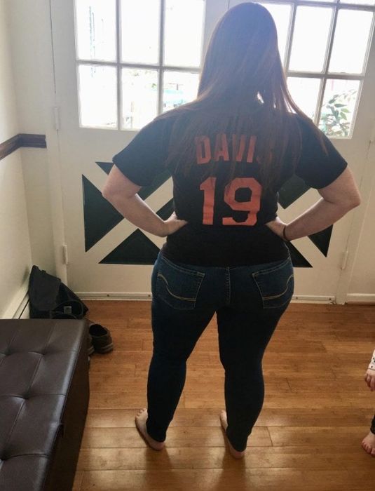 A reviewer modeling the jeans from behind