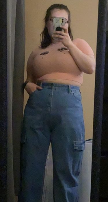 a reviewer snapping a mirror selfie in the jeans