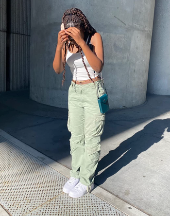 Reviewer in the olive green version of the pants