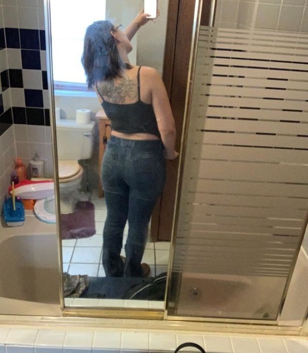 a reviewer wearing the jeans from the back
