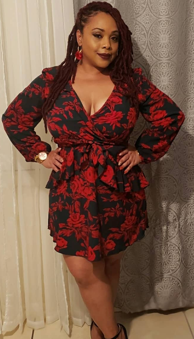 Reviewer showcasing the floral dress