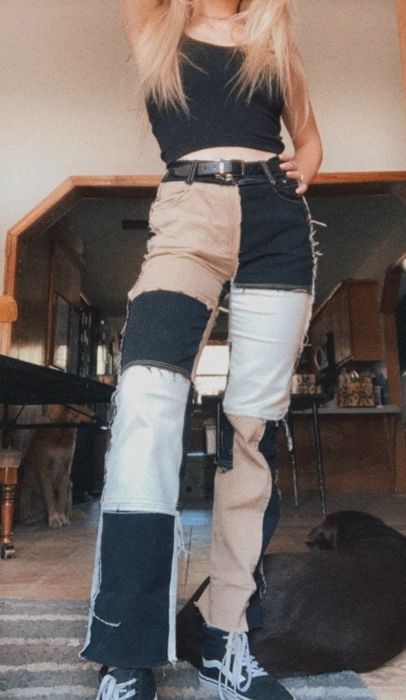a reviewer wearing the brown and black jeans