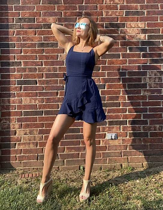 Reviewer in a navy blue dress