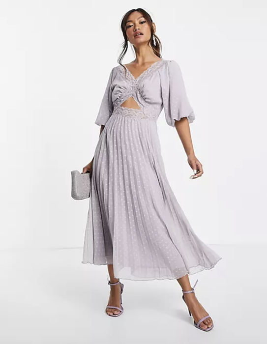 a model wearing the lilac midi dress