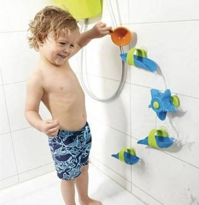Child enjoying a bath ball track