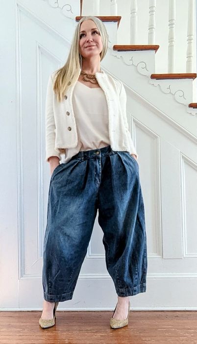 A reviewer rocking dark wash denim bloomers with an elastic waistband.