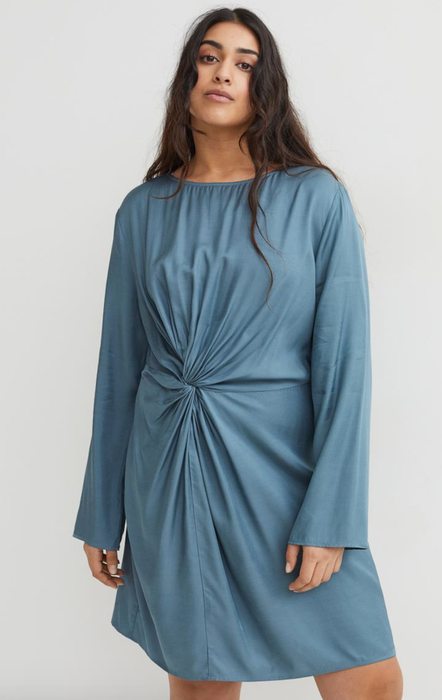Model showcasing a blue dress