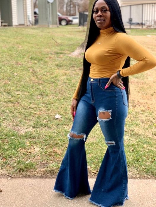 a reviewer showcasing the bell bottoms