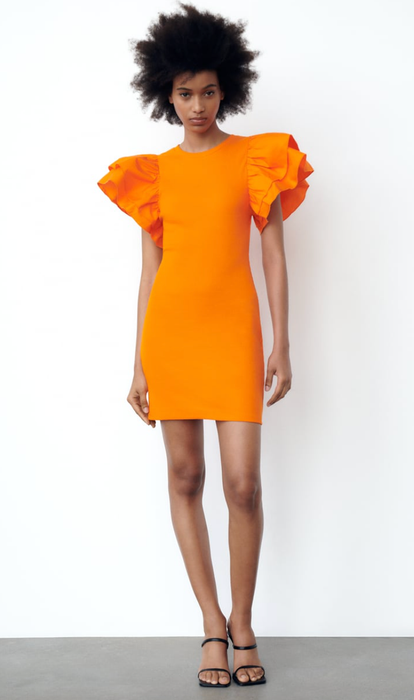 Model showcasing an orange dress