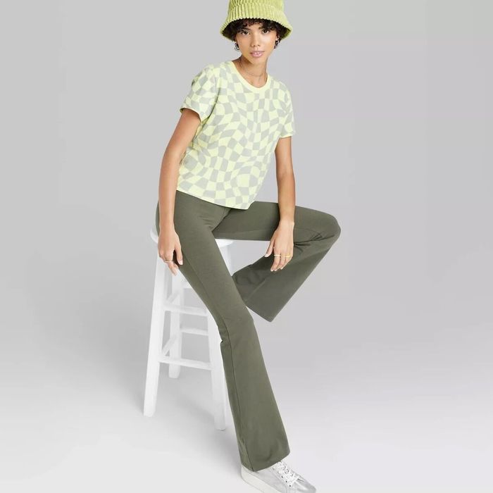 Model showcasing high-waisted flare leggings