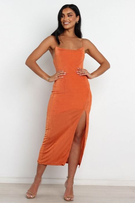 model wearing the orange high-sleeve slip dress