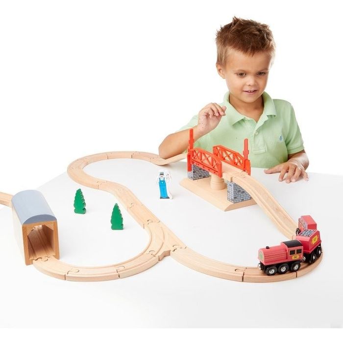 Child playing with a train set
