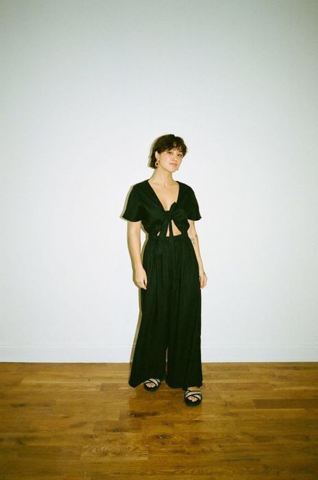 Another model showcasing the jumpsuit in size S