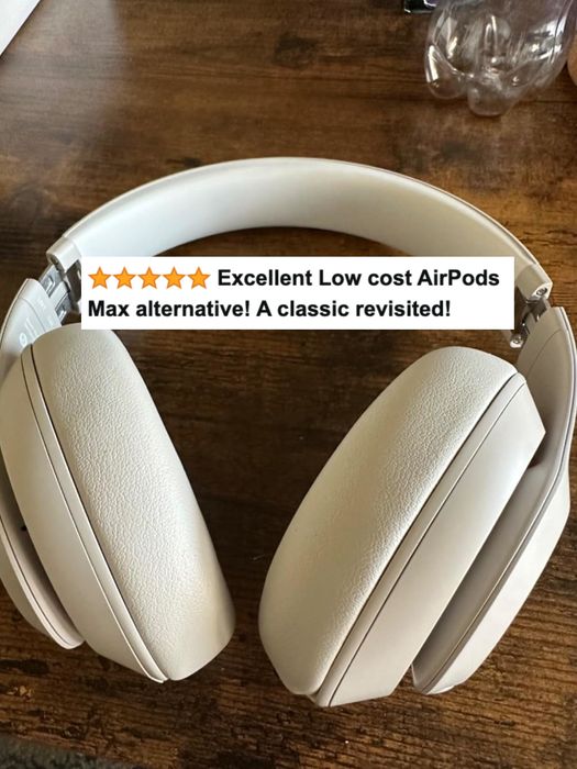 A reviewer’s white headphones with accompanying review text