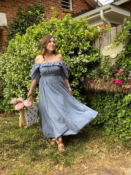 Another reviewer wearing the blue dress