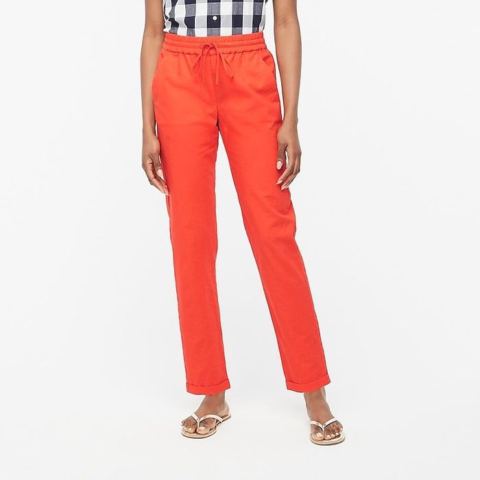 A model wearing the orange drawstring pants.